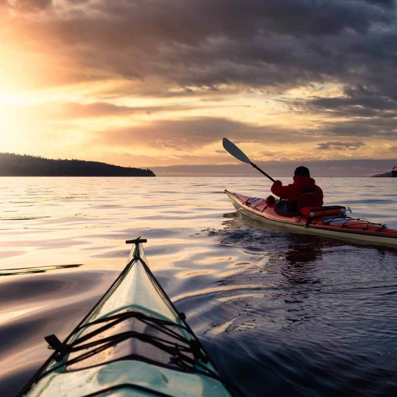 Sea kayaking under a dramatic sky