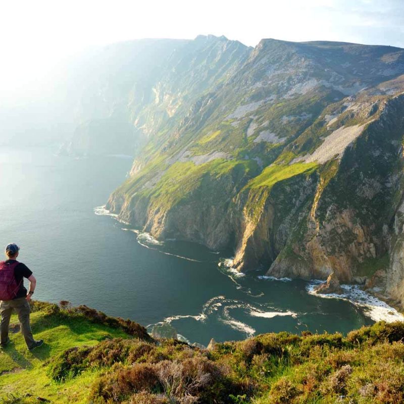 Slieve League Sea Cliffs with a person overlooking the ocean