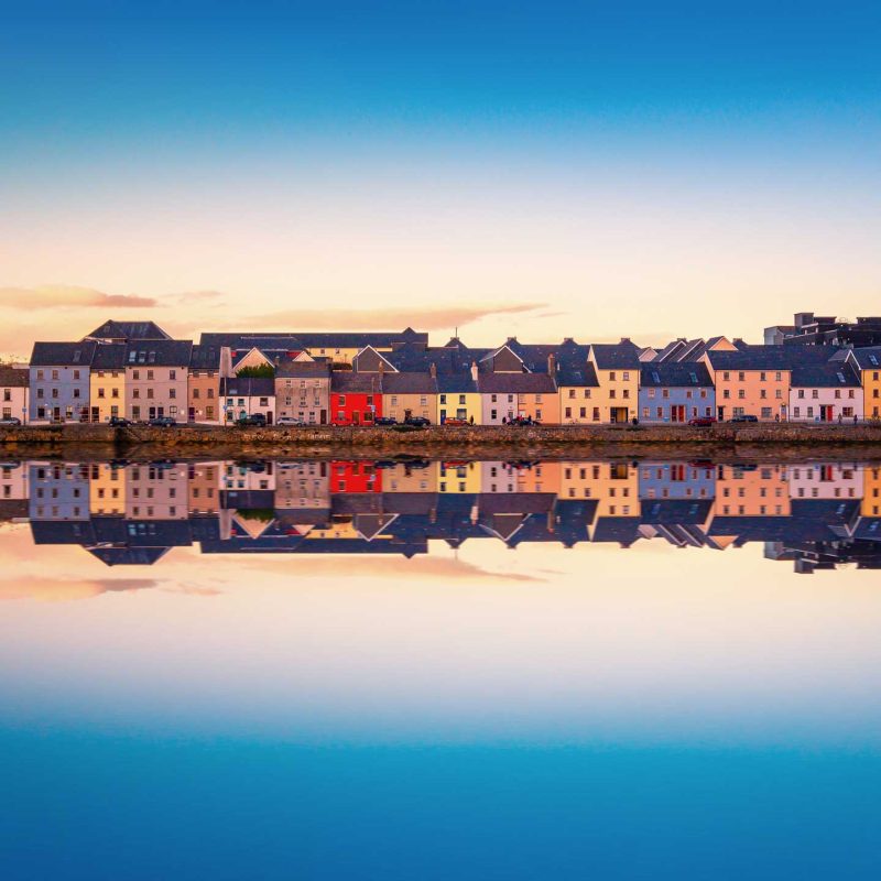 Galway city at dusk with dramatic reflections in the water