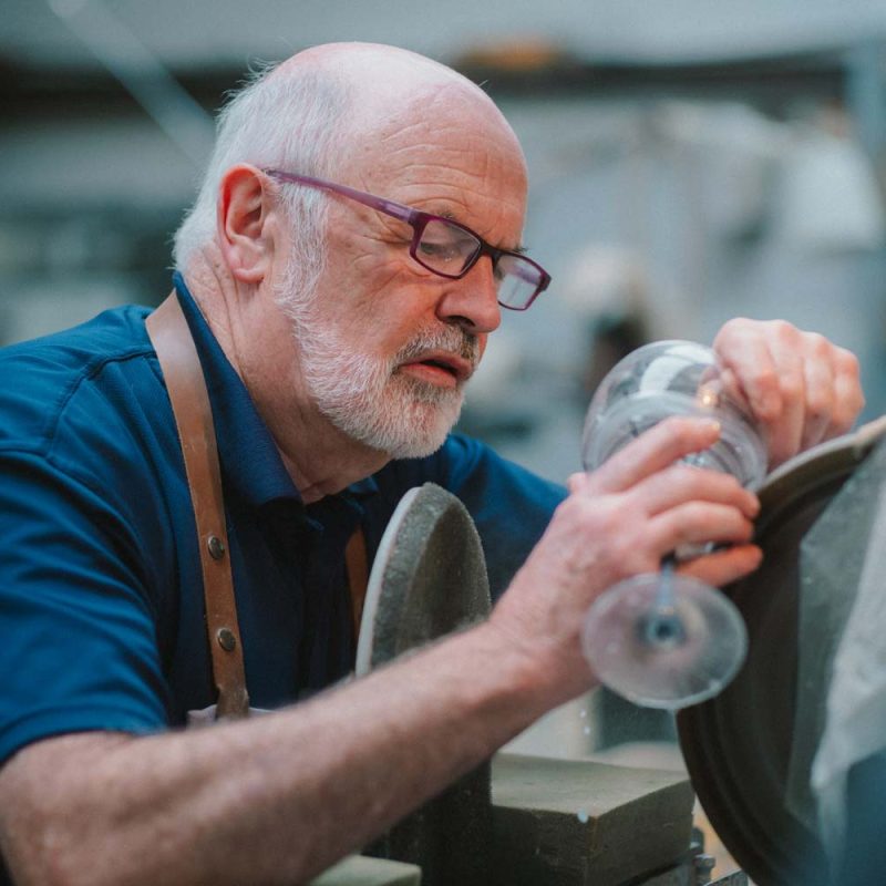 A man cutting crystal